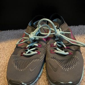 Grey, pink, and blue Nike’s